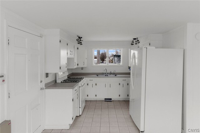 kitchen featuring white cabinetry, light tile patterned floors, white appliances, and sink