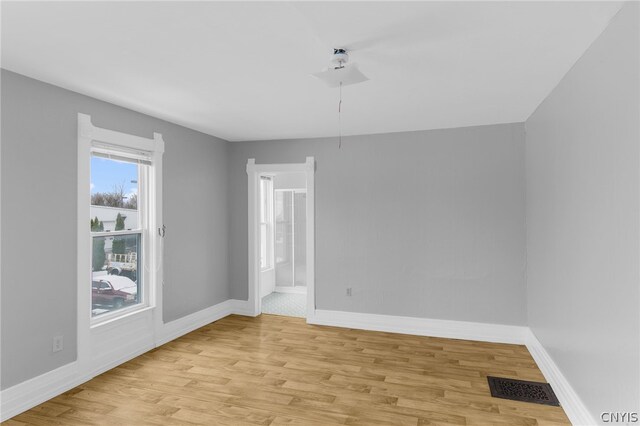 spare room with light wood-type flooring