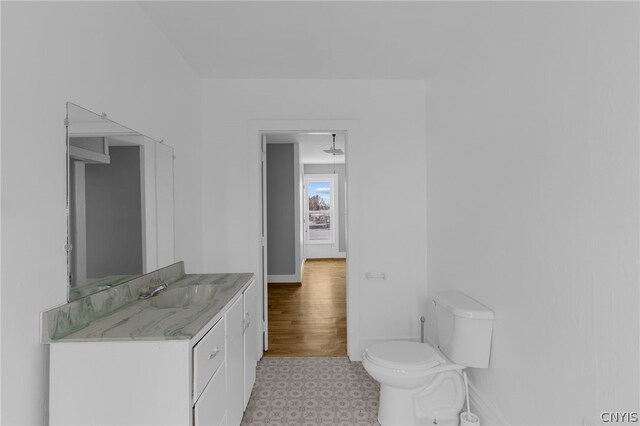 bathroom featuring vanity, toilet, and tile patterned floors