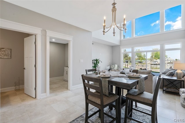 tiled dining area featuring a notable chandelier