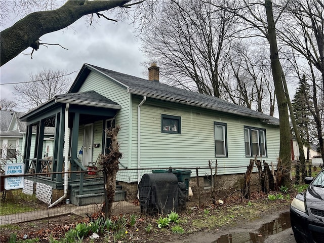 view of property exterior featuring a porch