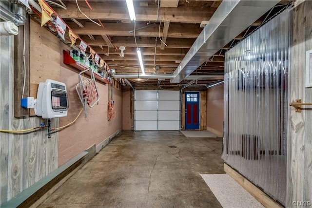 garage featuring heating unit