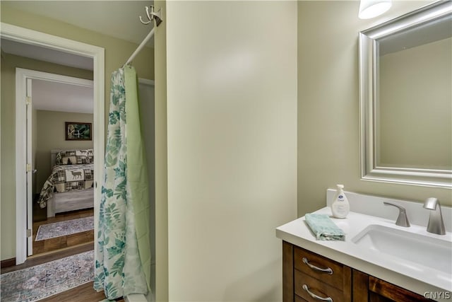 bathroom featuring hardwood / wood-style flooring and vanity