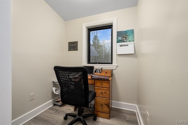 home office with hardwood / wood-style floors