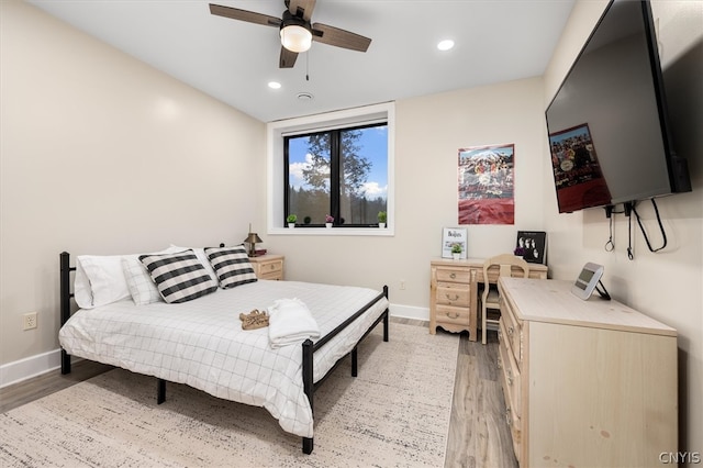 bedroom featuring light hardwood / wood-style floors and ceiling fan