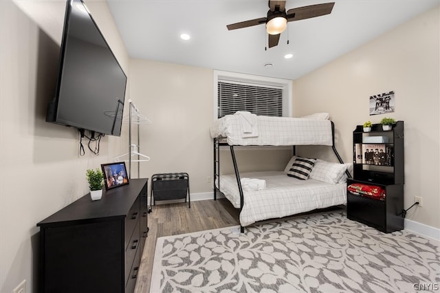 bedroom featuring light hardwood / wood-style floors and ceiling fan