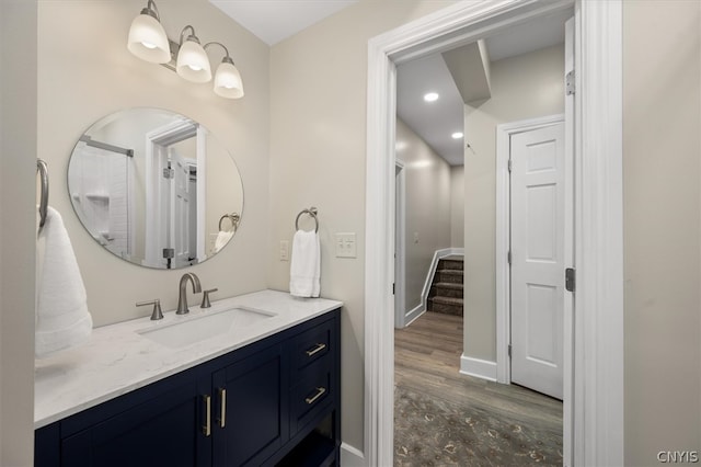 bathroom featuring vanity and hardwood / wood-style floors