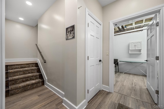 corridor with light hardwood / wood-style floors