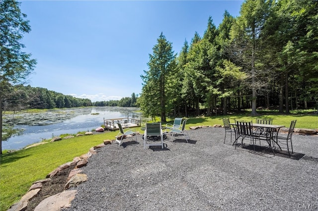 view of patio with a water view