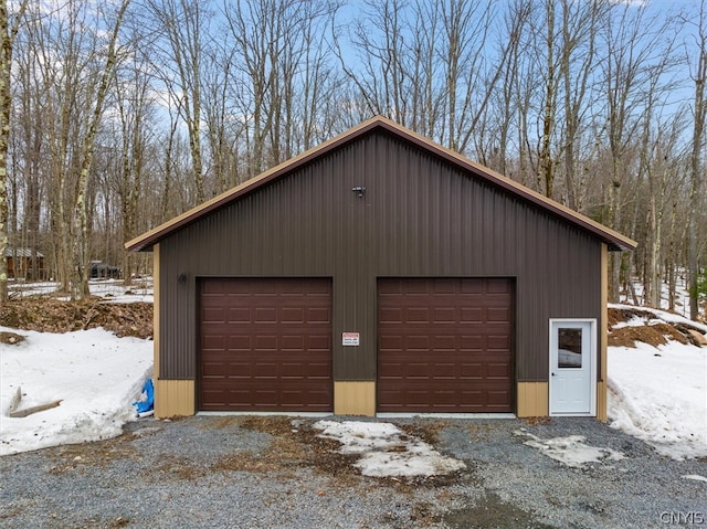 view of snow covered garage