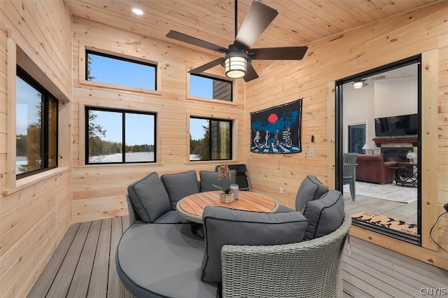 wooden deck featuring ceiling fan