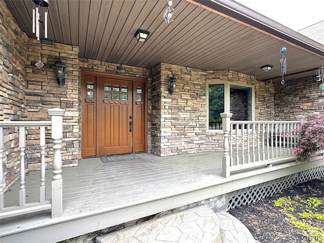 doorway to property with a porch