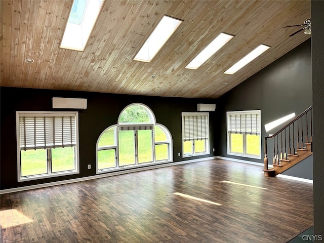 unfurnished living room featuring a wealth of natural light, high vaulted ceiling, and hardwood / wood-style floors