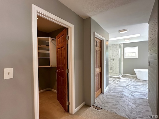 hallway featuring light parquet flooring