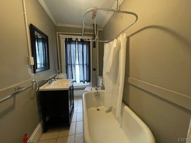 full bathroom with tile patterned flooring, toilet, vanity, shower / tub combo, and ornamental molding