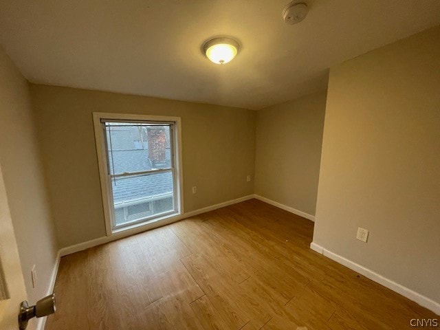 empty room with light wood-type flooring