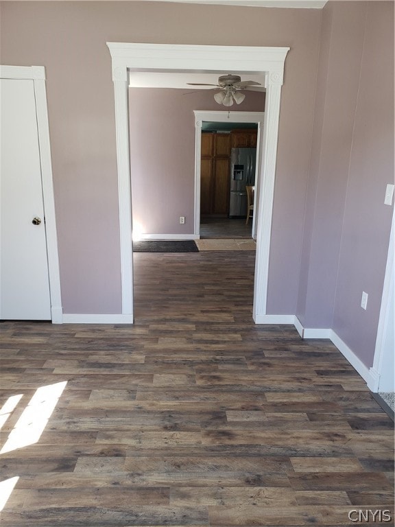 spare room featuring ceiling fan and dark hardwood / wood-style flooring