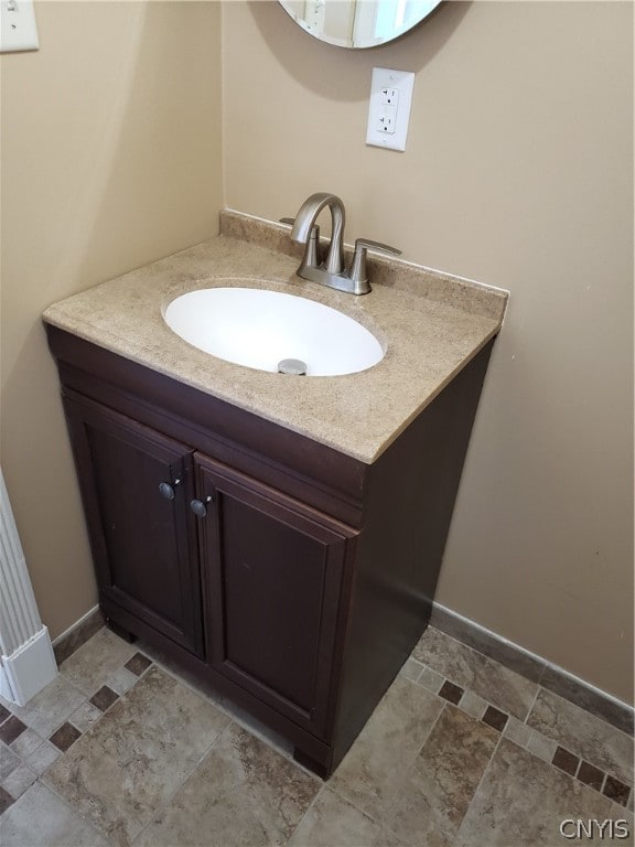 bathroom featuring tile floors and vanity