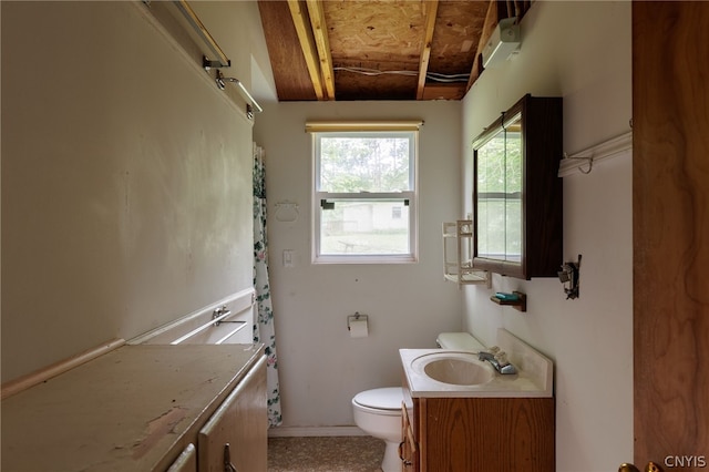 bathroom with toilet, vanity, and wooden ceiling