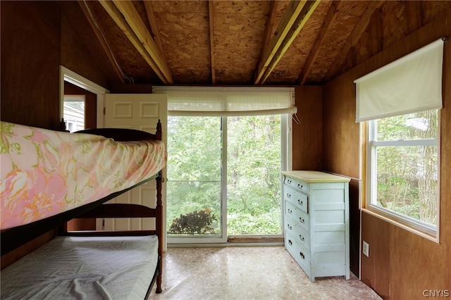 unfurnished bedroom with lofted ceiling