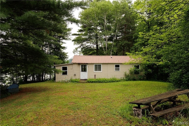 back of house with a yard