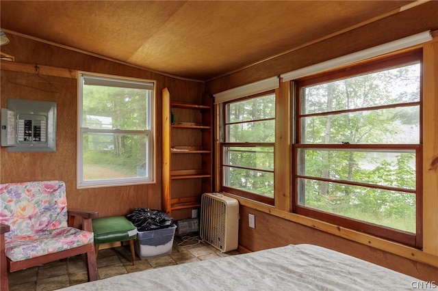 sunroom featuring a healthy amount of sunlight and vaulted ceiling