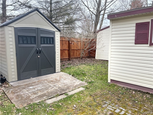 view of shed / structure with a lawn