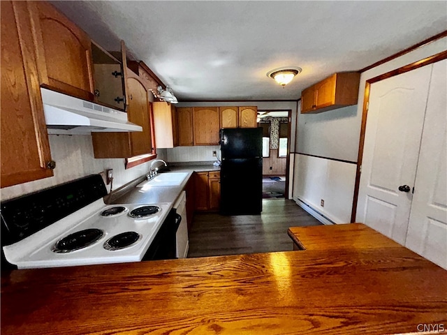 kitchen with black fridge, stove, a baseboard heating unit, dark wood-type flooring, and sink