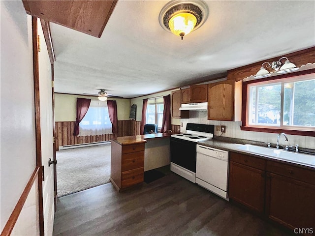 kitchen featuring ceiling fan, white appliances, dark wood-type flooring, a baseboard heating unit, and sink