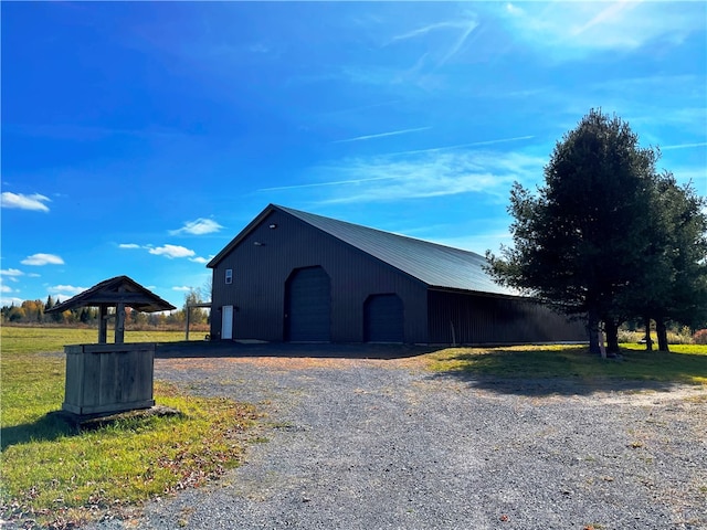 view of outbuilding with a garage