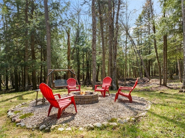 view of yard with a fire pit