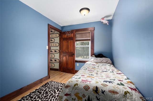 bedroom with light hardwood / wood-style floors