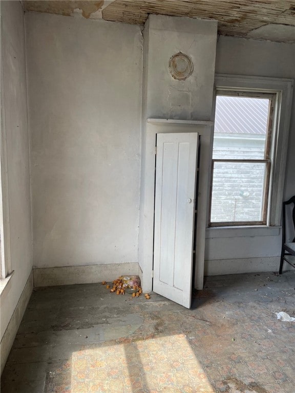 unfurnished bedroom featuring multiple windows