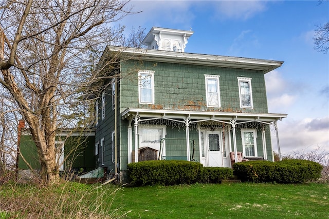 italianate-style house with a front lawn