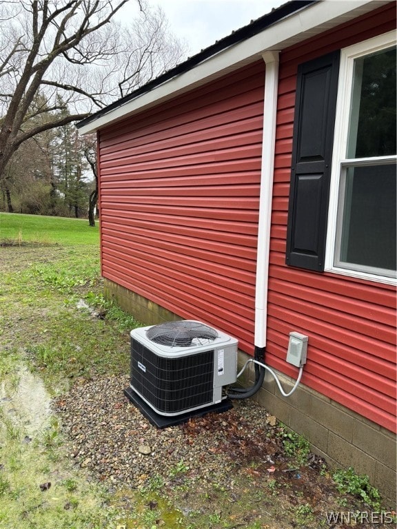 view of home's exterior featuring central AC unit