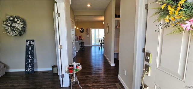 hall with dark hardwood / wood-style flooring