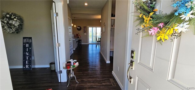 hallway with dark hardwood / wood-style floors