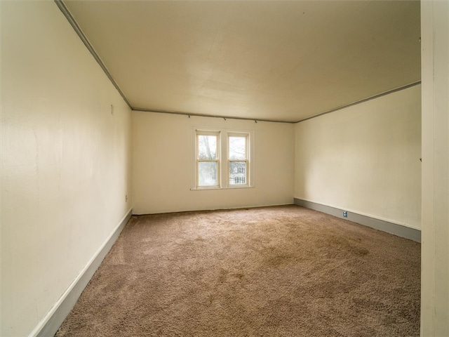 spare room with dark carpet