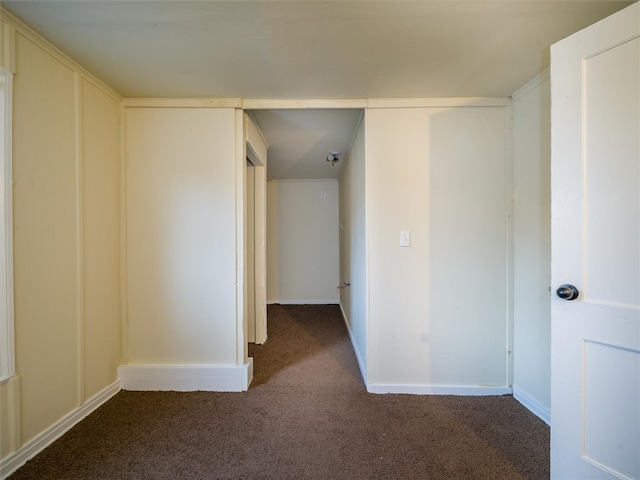 corridor with dark carpet