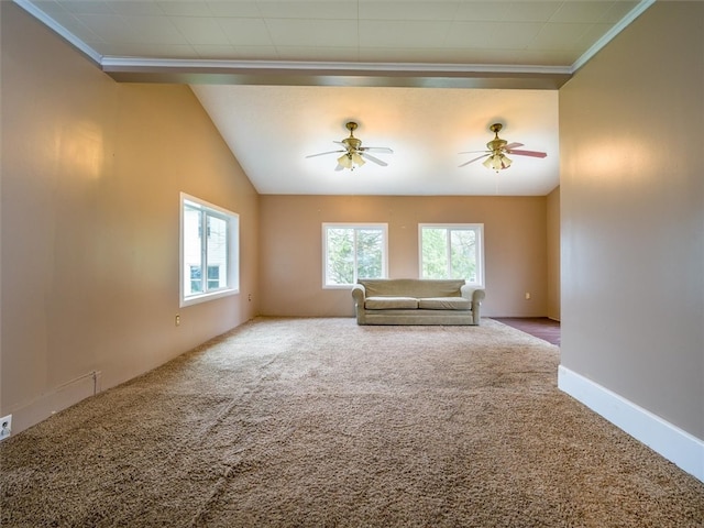 carpeted spare room featuring plenty of natural light and ceiling fan