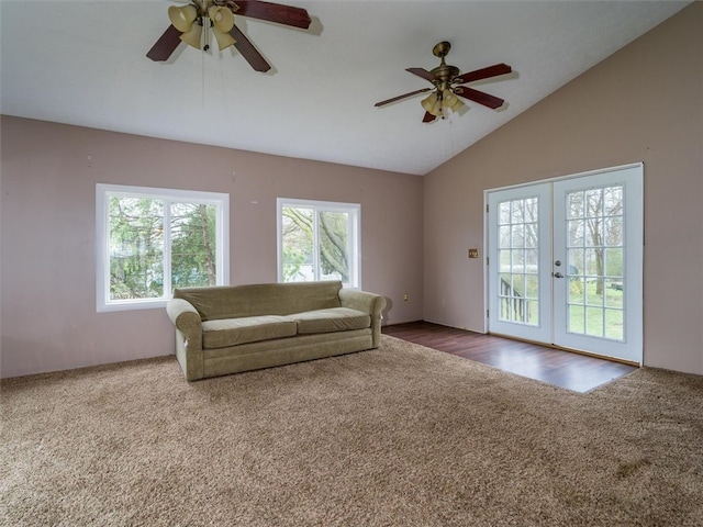 carpeted living room with french doors, a healthy amount of sunlight, ceiling fan, and lofted ceiling