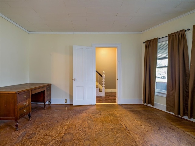 unfurnished room featuring crown molding and dark hardwood / wood-style floors