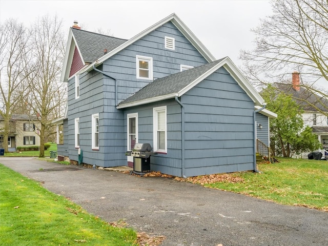 bungalow-style house featuring a front yard