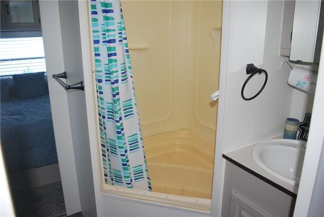 bathroom featuring vanity and shower / tub combo with curtain