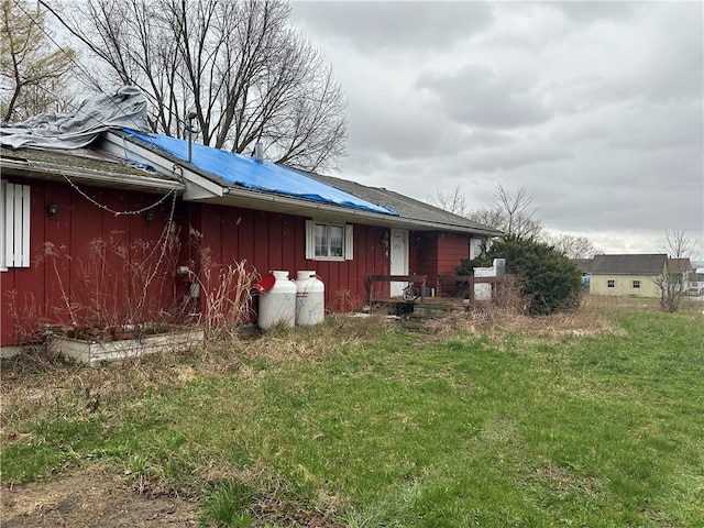 view of home's exterior with a yard