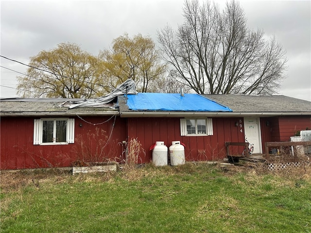 view of property exterior featuring a lawn