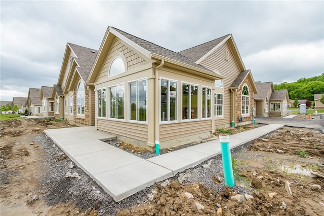 view of side of home featuring a patio