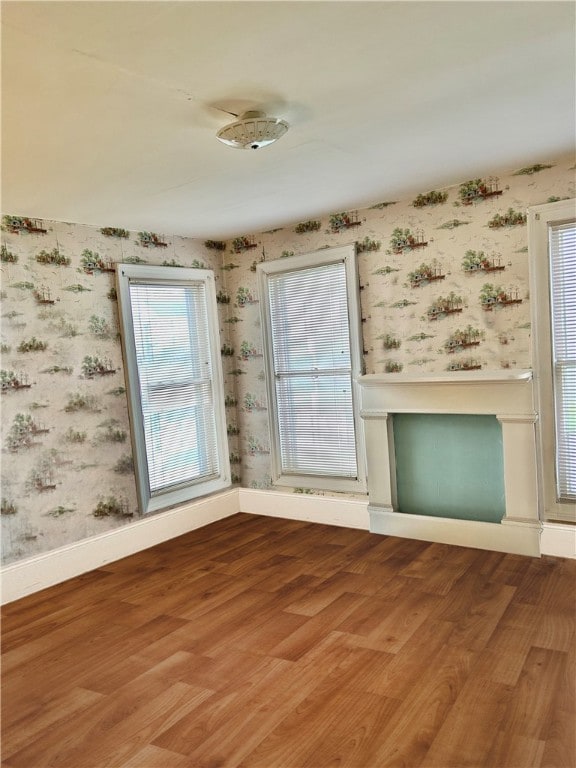 unfurnished living room with hardwood / wood-style flooring