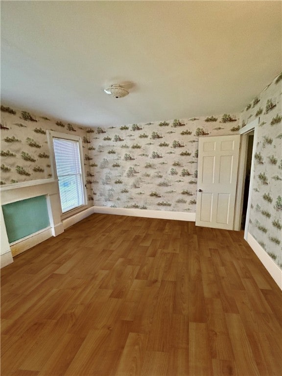 spare room featuring hardwood / wood-style flooring