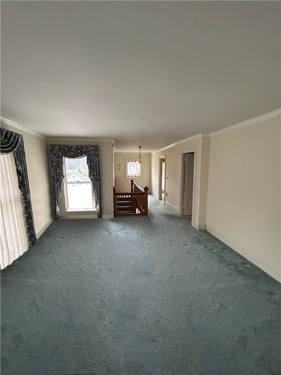 unfurnished bedroom featuring crown molding and dark carpet